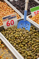 Buckets of olives for sale street food market