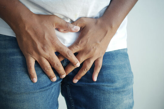 the concept of prostate and bladder problem, crotch pain of a young person 