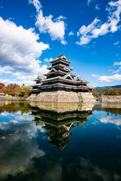 Matsumoto Castle tower reflected in the inner moat, Japan