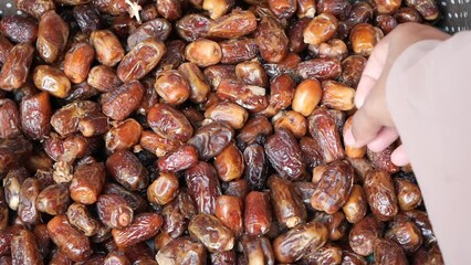 top view of women hand pick a date fruit 