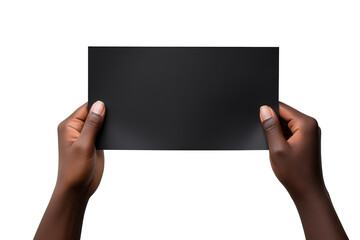 A human hand holding a blank sheet of black paper or card isolated on white background