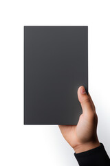 A human hand holding a blank sheet of black paper or card isolated on white background