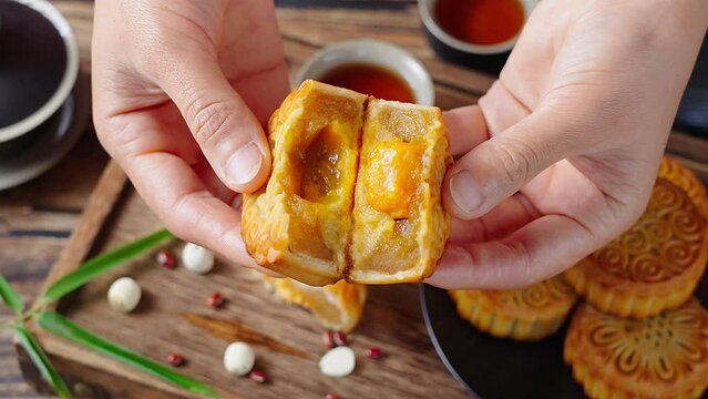 Traditional Chinese mid autumn festival food moon cake on wooden table	