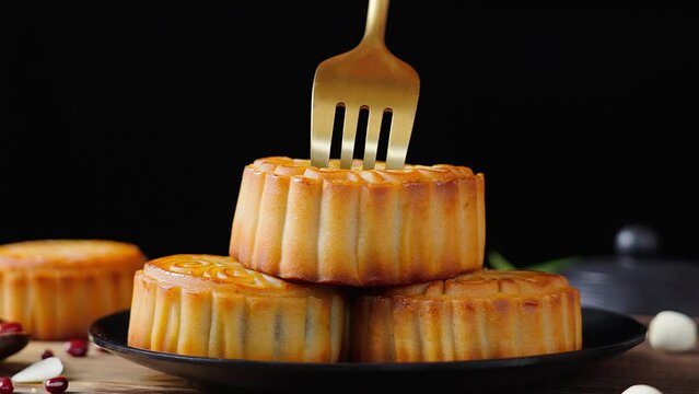 Traditional Chinese mid autumn festival food moon cake on wooden table	