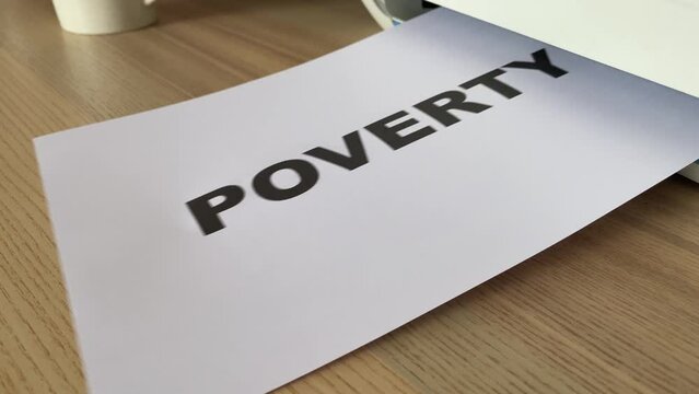 “Poverty” black text word on paper sheet A4 document sliding out of printer scanner on wooden table close up view