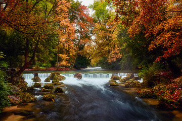 waterfall in autumn forest, fall, indian summer, Munich, Bavaria, Germany