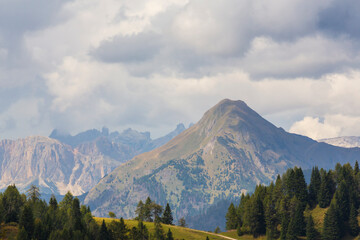 Landscape in the Dolomite Mountains in summer, with dramatic storm clouds