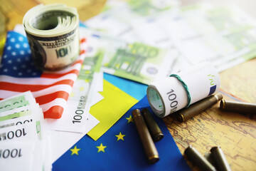 The concept of European Union support for Ukraine in a military conflict. Solidarity. Politics. Flags are on the table.