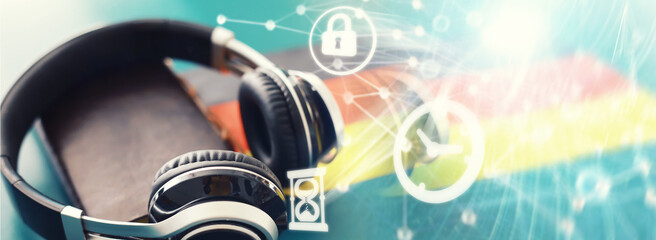Background concept polyglot. Headphones and flag. The study of foreign subjects. Audiobooks in a foreign language.