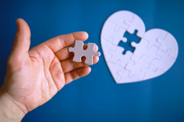 Doctor`s desk in the clinic's office. Stethoscope, puzzle heart, prescriptions on the table.