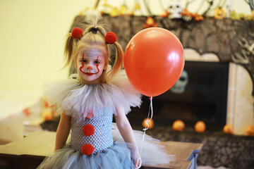 happy laughing child girl in costume to halloween