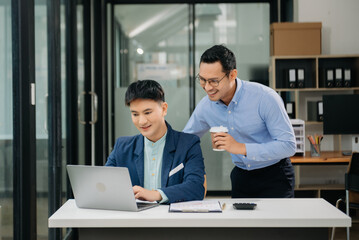 Male discussing new project with business colleague. Young man talking with young man in office.