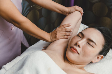 Chiropractor arm shoulder stretching woman relax in body spa for healthcare wellness