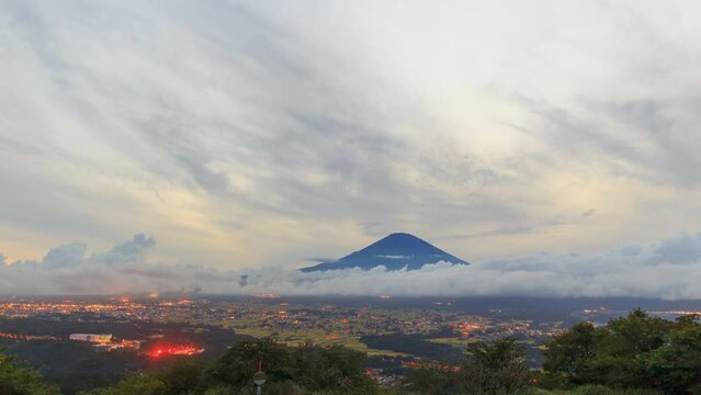 Sunset time lapse of Mt. Fuji with cloud and city light movement