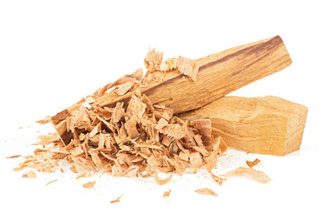 Palo santo wood sticks and wooden chips isolated on a white background. Bursera Graveolens - holy...