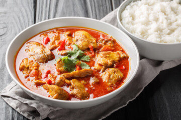 Asian chicken curry in a sauce consisting of onion, ginger, lemongrass, pepper, garlic and tomato...