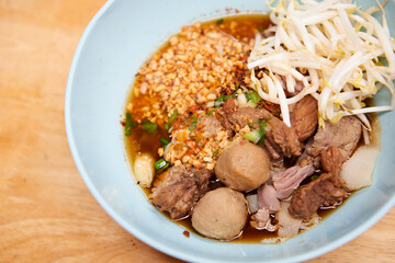 Rice stick noodles with braised beef and meatball in a bowl