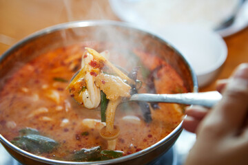 Hot spicy and Sour Seafood Soup in pot