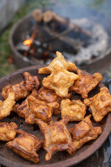 A wooden plate with handmade argentine pastries called pastelitos