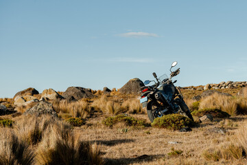 Dual purpose motorbike on roads mountain of Peru at sunset