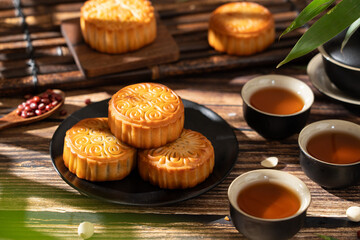 Traditional Chinese mid autumn festival food moon cake on wooden table	