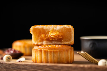 Traditional Chinese mid autumn festival food moon cake on wooden table	
