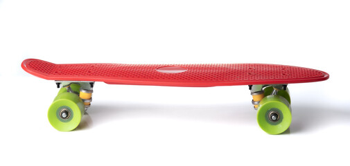 Red plastic skateboard on a white background © showcake