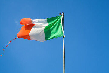 Italian Italy flag hanging waving wind blue sky tricolor green