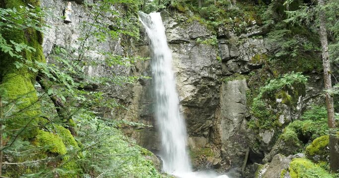 Sibli Waterfall in Enterrottach gemeinde Rottach-Egern in southwest of Lake Tegernsee. Natural spectacle falling with a height of about 15 meters in a shimmering turquoise pool
