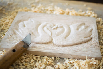 Wood carvings, tools and processes work closeup