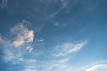 Fototapeta na wymiar Bright sky in daylight with floating clouds.