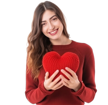 Happy young woman wigth knitted heart in hands