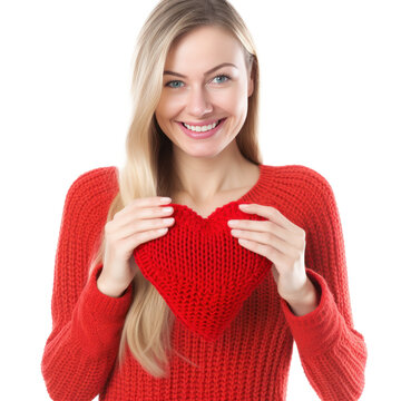 Happy young woman wigth knitted heart in hands