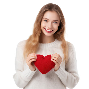 Happy young woman wigth knitted heart in hands