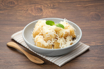 Fried cassava with cheese or singkong goreng keju, Indonesian traditional food. 
