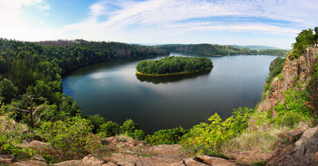 Fototapeta na wymiar Lake and island with trees. Water reservoir Sec, Czech Republic, Europe