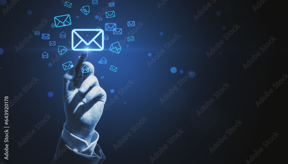Poster close up of male hand pointing at glowing email letter icons on dark blue background with mock up pl