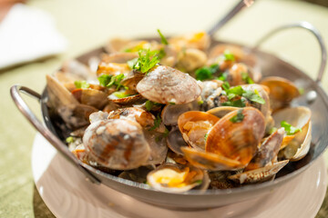 Grilled clam with lemon sauce dish