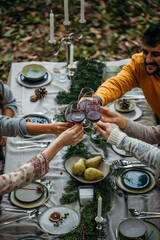 Friends clinking glasses in a toast, celebrating the simple joys of life while surrounded by nature's splendor.
