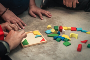 teamwork challenge hands gathered around a central puzzle game