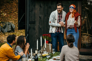 A picturesque garden table adorned with elegant place settings, invites guests to a memorable outdoor dining experience.