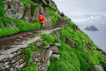 visitors on the steep path up to the monastery, Skellig Michael island, Mainistir Fhionáin (St. Fionan’s Monastery), county Kerry, Ireland, United Kingdom