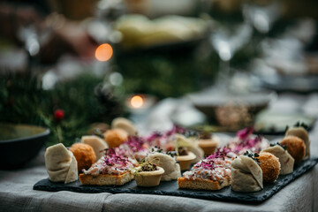 A close-up shot of an amuse-bouche, a bite-sized delight that kickstarts the culinary adventure at this garden lunch.
