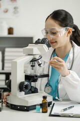 Female scientist researcher conducting an experiment working in the chemical laboratory.
