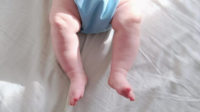 Close-up of the little feet of a newborn baby
