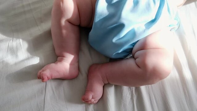 Close-up of the little feet of a newborn baby