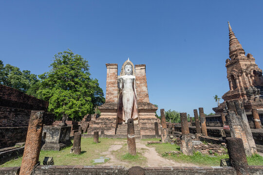 An old standing Buddha image in the park