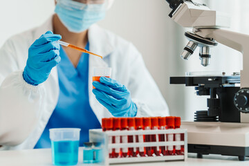 Close up scientist conducting precise virus lab test, scientific methodology, microbiologist...