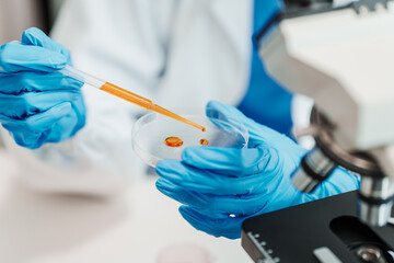 Close up scientist conducting precise virus lab test, scientific methodology, microbiologist conducting virus detection and testing in progress