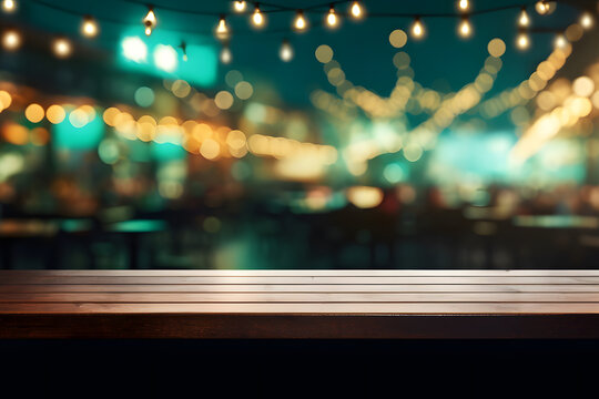 Empty wooden table top with lights bokeh background.